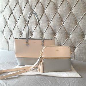 Never used tote and crossbody bag. Can hold up to 14” laptop. Sturdy. Very cute.